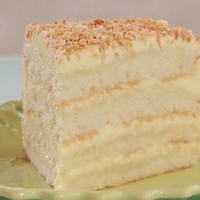 Image of Bobby Flays Throwdowns Toasted Coconut Cake With Coconut Filling And Coconut Buttercream Recipe, Group Recipes